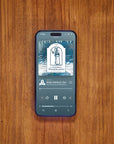 Phone displaying Apple Podcast The Gnomes of Wondergarten on wooden table